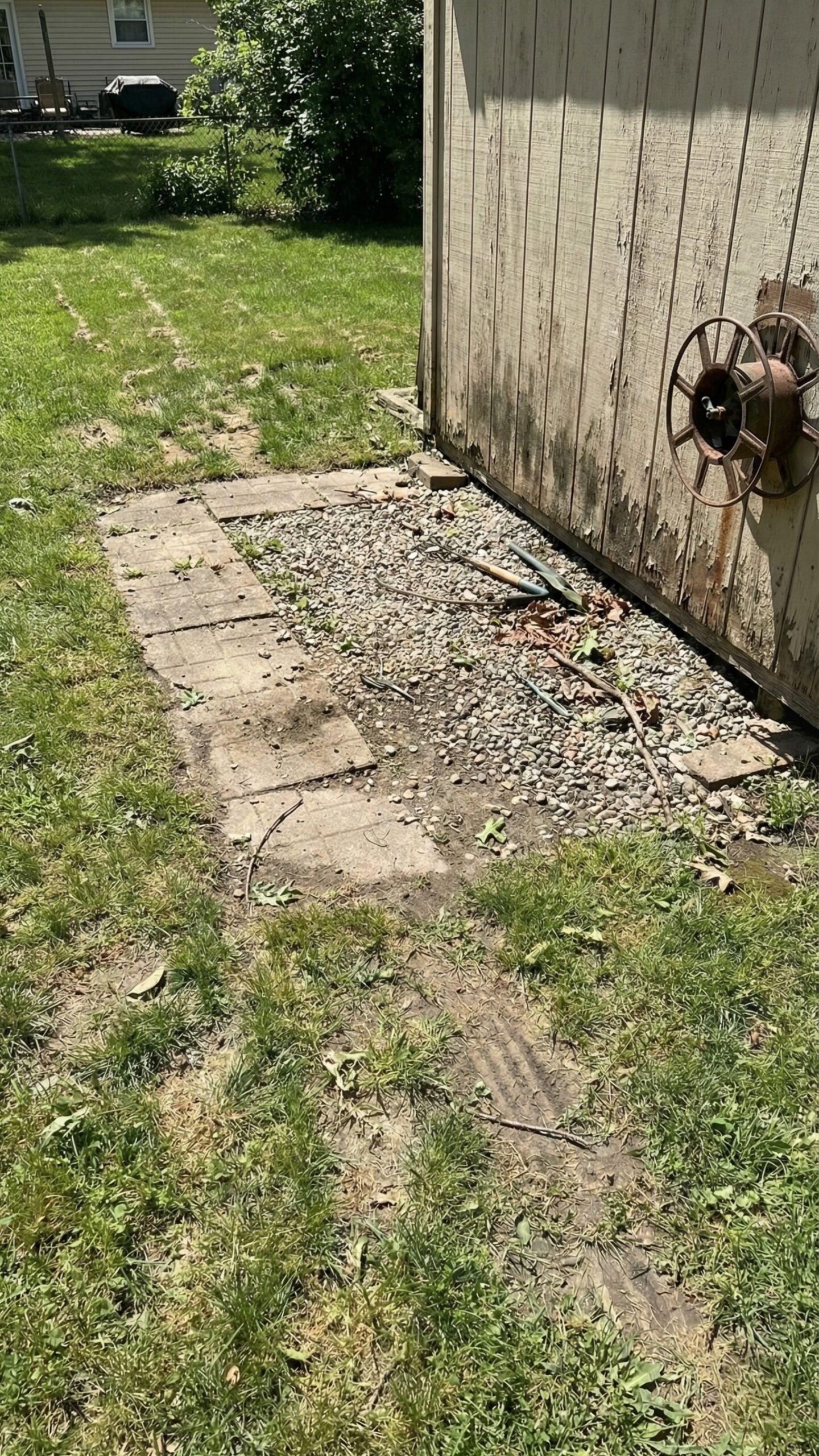 Dedicated mower parking spot with pavers