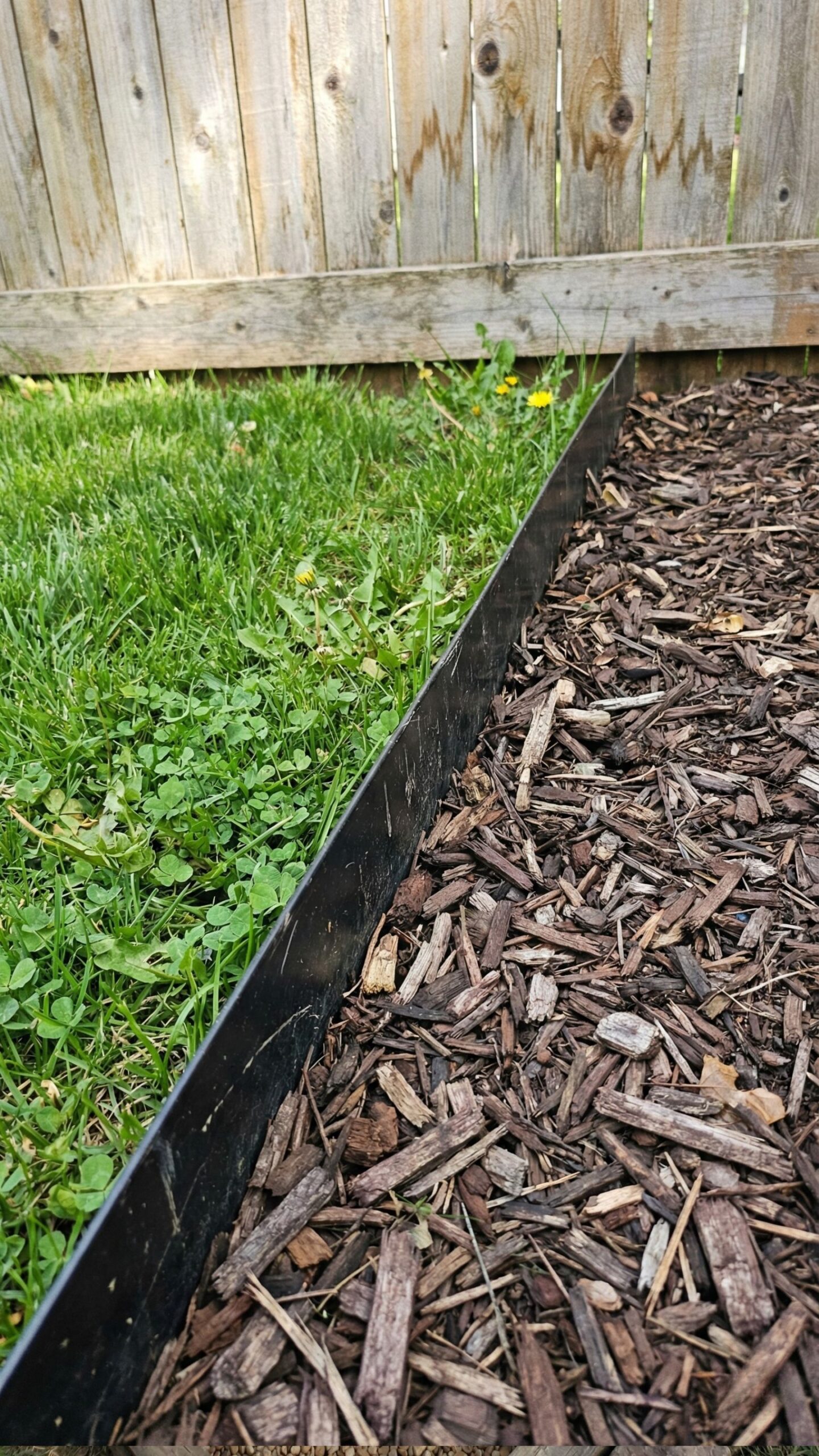 Metal or stone lawn edging for easy mowing