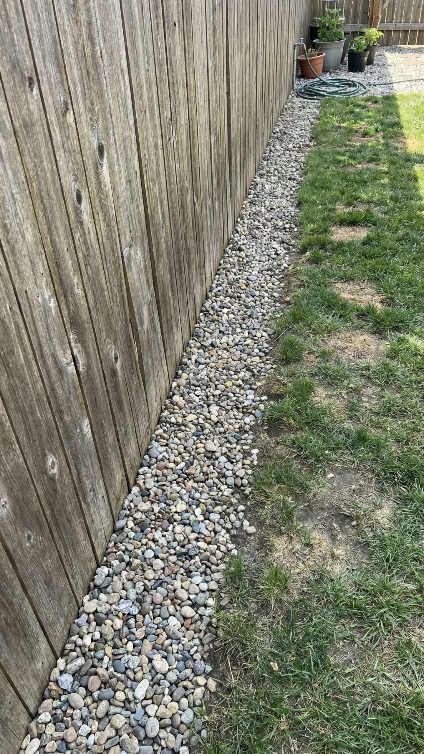 Straight gravel mower lane along fence